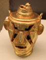 Quimbaya culture stylized gold head of chieftain from Colombia at Museum of America. Madrid, Spain.