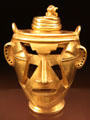 Quimbaya culture stylized gold head of chieftain from Colombia at Museum of America. Madrid, Spain