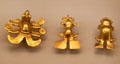 Gold pendants in form of hummingbird & frogs from Diquis, Costa Rica at Museum of America. Madrid, Spain.