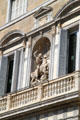 St Michael slaying dragon statue on facade of Palau de la Generalitat de Catalunya. Barcelona, Spain.