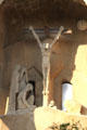 Christ crucified on Passion Facade at Sagrada Familia. Barcelona, Spain.