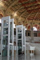 Museum elevator shafts plus performance seating in oval room of Palau Nacional. Barcelona, Spain