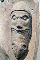 Stone carving of man eating a horned animal from church of Santa Maria de Ripoll at Museu Nacional d'Art de Catalunya. Barcelona, Spain.