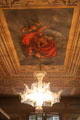Chandelier hanging from ceiling mural at Palau Reial. Barcelona, Spain