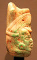 Acrobat jade pendant from Maya Guatemala or Mexico at Barbier Mueller Precolumbian Art Museum. Barcelona, Spain.