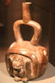Ceramic stirrup-handle vessel with animal from Cupisnique Culture, Peru at Barbier Mueller Precolumbian Art Museum. Barcelona, Spain.