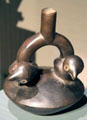 Ceramic stirrup-handle vessel with birds from Chimu Culture, Peru at Barbier Mueller Precolumbian Art Museum. Barcelona, Spain.