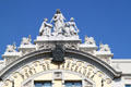 Port de Barcelona building crown with maritime statues. Barcelona, Spain.