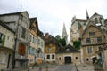 Half-timbered buildings on Place du Coche D'Eau plus Abbey of St. Germaine. Auxerre, France.