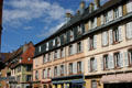 Pastel buildings on Place d'Armes. Belfort, France.