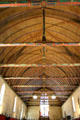 Great hall of the poor vaulted ceiling shaped like a boat hull in Hotel Dieu. Beaune, France.