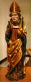 Wooden statue of St Nicholas with three bags of gold from upper Rhine in Unterlinden Museum. Colmar, France.