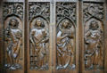 Oak choir stalls carved with saints in Unterlinden Museum. Colmar, France.