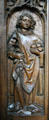 Oak choir stall carved with St. Stephen in Unterlinden Museum. Colmar, France.