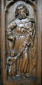 Oak choir stall carved with St Joseph or St Christopher & Christ child in Unterlinden Museum. Colmar, France.