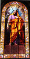 Christ with lily stained glass window at Eglise Notre Dame de Pitie & St Elisabeth. Paris, France.