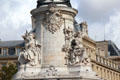 Equality & liberty symbols on base of French Revolution monument at Place de la République. Paris, France.