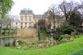 Mairie of III Arrondissement over gardens of Square du Temple in Le Marais. Paris, France.