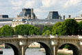 Pont Neuf with domes of Louvre beyond. Paris, France.