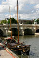 Sail boat in front of Pont Neuf. Paris, France.
