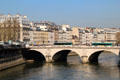 Pont Saint-Michel with left banks buildings along Quai des Grands Augustins. Paris, France