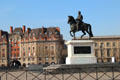 Equestrian Statue of King Henri IV with left bank buildings at end of Pont Neuf Bridge. Paris, France.