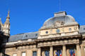 Square dome of Palais de Justice with spire of St Chapelle. Paris, France.