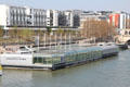 Josephine Baker swimming pool floating on River Seine near National Library. Paris, France.