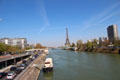 Seine with Radio France round building, Pont de Grenelle, Eiffel Tower & Residential towers. Paris, France.