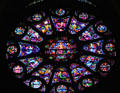 Christ with evangelists stained glass rose window in Cathedral. Reims, France.