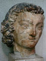 Sculpted head of St. Jean from Cathedral in Tau Palace. Reims, France.