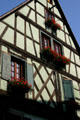 Half-timbered house with flowers. Riquewihr, France.