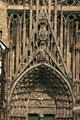 Intricate Gothic carvings by Erwin von Steinbach over central door of Cathedral. Strasbourg, France.