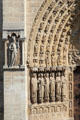 Saints carvings on center Gothic portal of Notre Dame Cathedral. Paris, France.