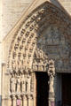 Left Gothic portal of Notre Dame Cathedral. Paris, France.