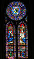 Queen praying to Christ stained glass window in Notre Dame Cathedral. Paris, France.