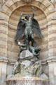 Archangel Michael wrestling devil by Francisque-Joseph Duret at St-Michel Fountain. Paris, France.