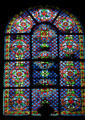Early-style stained glass window at St-Germain-des-Prés. Paris, France.