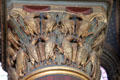 Restored gilded mythical creatures on column capital at St-Germain-des-Prés. Paris, France.