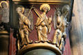 Restored gilded angels & saints on column capital at St-Germain-des-Prés. Paris, France.