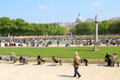 Parisians relaxing around ponds of Luxembourg Gardens. Paris, France