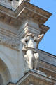 Sculpted figure supporting part of facade of Gobelins Manufactory. Paris, France.