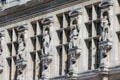 Carved prominent figures of Paris on Paris City Hall. Paris, France.