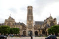 Gothic tower & porches between wings of Saint-Germain-l'Auxerrois. Paris, France.
