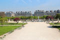 Grand basin in Tuileries Garden with rue de Rivoli buildings beyond. Paris, France.