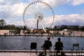 Occasionally a giant Ferris Wheel is temporarily erected at end of Tuileries Garden. Paris, France.