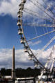 Occasional giant Ferris Wheel seen over Obelisk at Place de la Concorde. Paris, France.