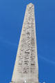 Hieroglyphics exalting reign of pharaoh Ramesses II on Luxor Obelisk at Place de la Concorde. Paris, France.