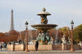 Fountain of Rivers marks navigation & commerce on rivers of France by Jacques Ignace Hittorff in northern position on Place de la Concorde with Eiffel Tower beyond. Paris, France.