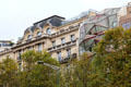 Mix of traditional & modern building facades on Champs Elysees. Paris, France.